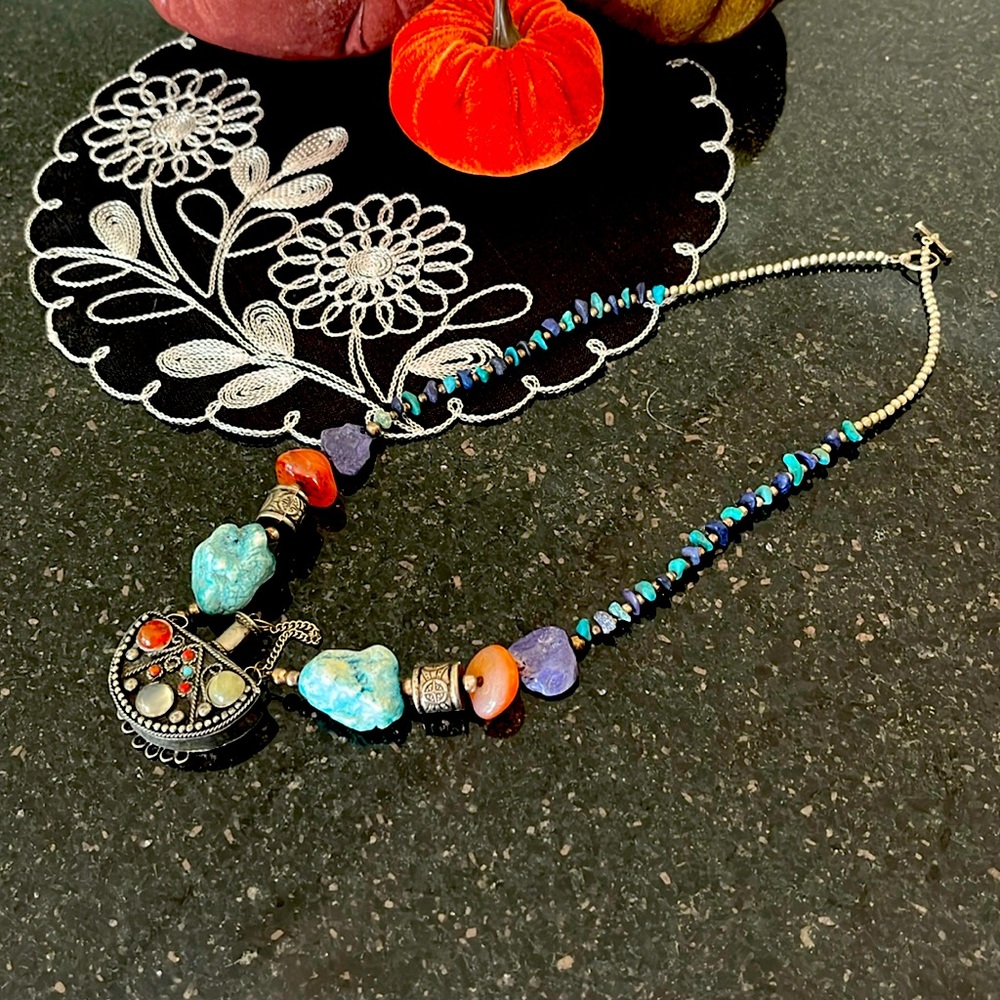 Turquoise, assorted gemstones and essential oil/fragrance bottle